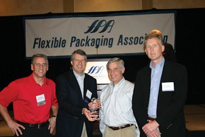 Packaging World presented Printpack with an award in recognition of its 50th anniversary. Publisher Joe Angel (shown far left) p