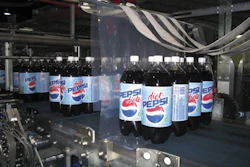 2-L bottles moving through a curtain of film