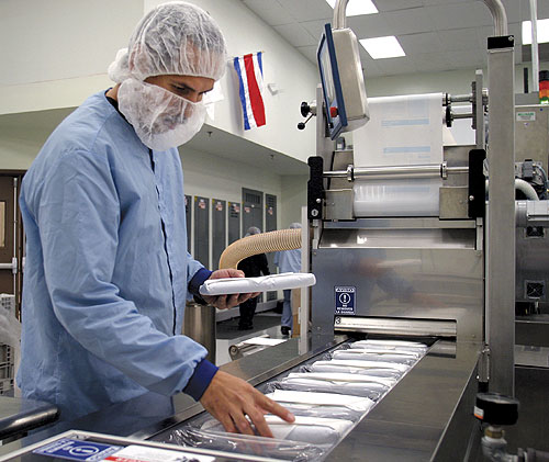 'Hybrid' packs of surgical drapes are produced on a thermoform/fill/seal line in Juarez, Chihuahua, Mexico.