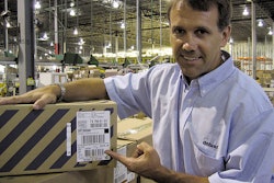 Little tag, big changes: Deluxe's director of engineering Jeff Nelson points to a small naked tag that RFID-enables a case of DV