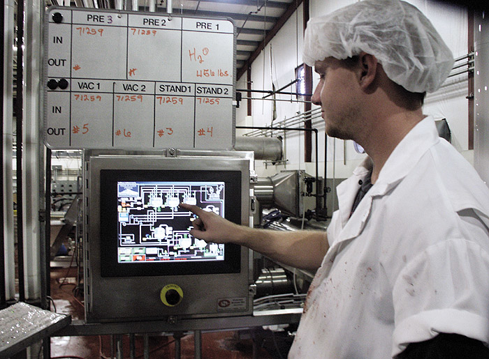 An operator checks the status of the batch on this operator terminal.