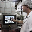 An operator checks the status of the batch on this operator terminal.
