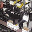 A dual-scale filling system at Marich Confectionery includes a specially designed indexing conveyor.