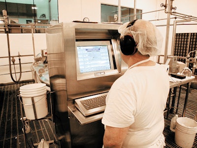 An operator checks the master recipe on the InTouch cheese Make Sheet screen for cooking a milk batch.