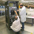 Technicians assembling a server.
