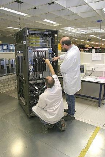 Technicians assembling a server.