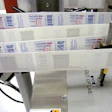 At Purdue Pharma, p-s label web tracks toward application station showing the printed label on one side, the RFID tag on the oth