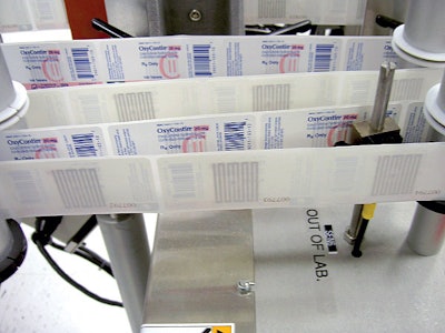 At Purdue Pharma, p-s label web tracks toward application station showing the printed label on one side, the RFID tag on the oth