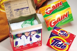 Film-laminated paperboard cartons for two Procter & Gamble dry detergent brands offer examples of the shelf 'pop' that store ma