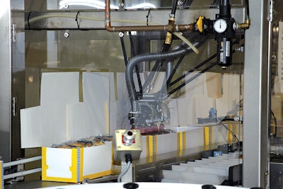 A new robotic carton loader places wrapped breakfast sandwiches into cartons on this line at Odom's Tennessee Quality Foods' pla