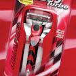Auto-racing graphics rev up interest among men for a triple-blade razor.