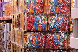 A bulk display from Frito-Lay gains attention in club stores. It uses printed, solid fiber trays and a glossy, high-clarity film