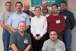 Nancy Cobb, who wrote the course book now used for the two-day Certified Trainer Program, stands surrounded by a few of her stud