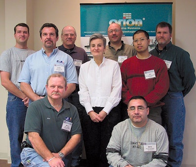 Nancy Cobb, who wrote the course book now used for the two-day Certified Trainer Program, stands surrounded by a few of her stud