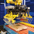 Mechanical clamp tool captures a multiwall bag for loading onto a pallet at Forbes Chocolate's Cleveland plant.