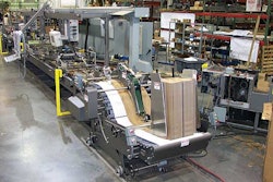 Operators use the touchscreen panels to control the paperboard beverage-carrier erector.