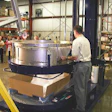 The first step in the K-one process is to place a corrugated tray on a pallet and hang a plastic bag from the K-one collar.