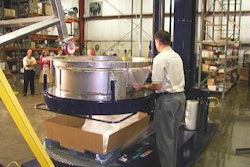 The first step in the K-one process is to place a corrugated tray on a pallet and hang a plastic bag from the K-one collar.