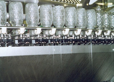 A triple-channel rinser is used to spray the inside of each bottle with paracetic acid, sterile water, and sterile air.