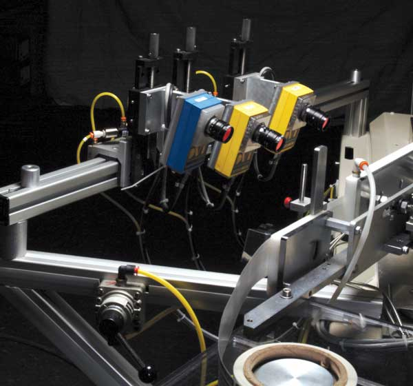The three smart cameras are all mounted upstream from the peel plate of the pressure-sensitive labeler.