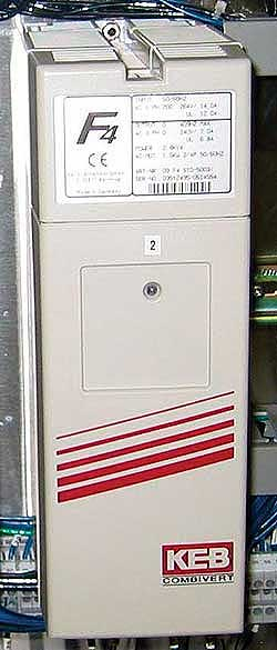 Econocorp's intermittent-motion Spartan cartoner employs a frequency inverter (top) that drives a gear motor (above). These com