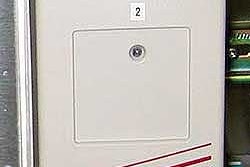 Econocorp's intermittent-motion Spartan cartoner employs a frequency inverter (top) that drives a gear motor (above). These com