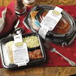 Each wraparound label seals the meal's tray and lid.