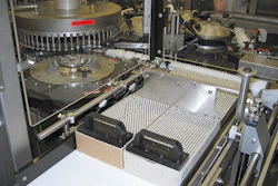 Above photo shows one of two infeed stations, including the feed screw, used to feed vials into the labeler.