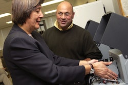 Maria Rubino, assistant professor of packaging science, and Fritz Yambach, associate professor of packaging, inspect a water-vap