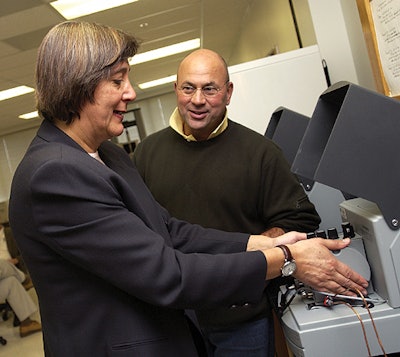 Maria Rubino, assistant professor of packaging science, and Fritz Yambach, associate professor of packaging, inspect a water-vap