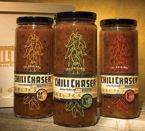 Lava Foods' Chili Chaser salsas use handsome keeper jars screen printed with peppers. Rustic paper labels reinforce the hand-pac