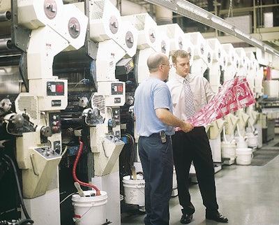 At the Ft. Dearborn facility where the Oberweis label is produced, pressman Tom Peters (left) and flexible packaging customer se