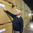 C&D Warehouse president Gene Cravey checks the sidewalls of some of Basell's boxes with new moisture barrier.
