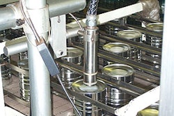 A short distance downstream from a new ink-jet date coder (inset), cans are collated and pushed into either an RSC or a tray; sh