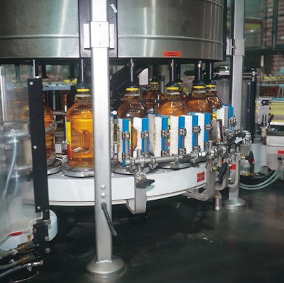 Front and back paper labels are applied at speeds to 220 1-gal bottles/min.
