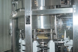 F-style HDPE bottles index around this 10-station indexing filler-capper, which fills agrichemical liquids at several stations b