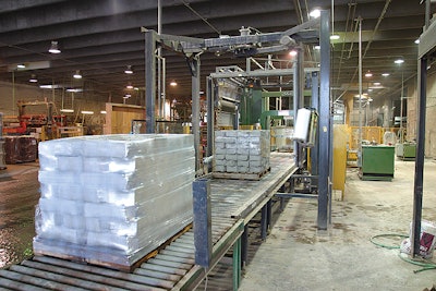 The new rotary tower wrapper (above and top) automatically wraps pallets arriving from the top-sheet dispenser (left). The compl