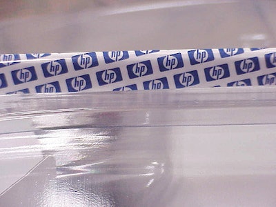 Sealing of the clamshell using a special p-s tape (inset) simplifies package opening.