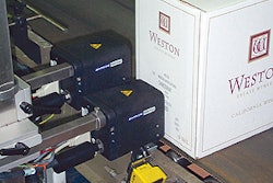Near the end of the line, hot melt ink-jet coding marks each case with lot and date code information.