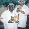 Leonard Cole (above left), North York plant manager, and Nick Boragina, Concord plant manager, display cartons of IQF product at