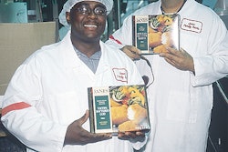 Leonard Cole (above left), North York plant manager, and Nick Boragina, Concord plant manager, display cartons of IQF product at