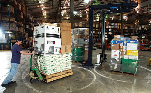 Three-station semi-automatic stretch wrapping helps the DC unitize loads more efficiently for shipment to 520 regional True Val