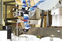 This labeler's sliding head makes it possible to apply labels on a bottle's top or side panel.