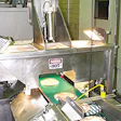 The first inspection checks the pizzas for any damage following shrink wrapping;