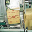 A key improvement to downstream packaging functions is this automatic case erector.