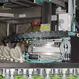 This pick-and-place robot uses vacuum pick-up cups to transfer filled cups from the filling/lidding system to the case packer.