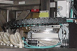 This pick-and-place robot uses vacuum pick-up cups to transfer filled cups from the filling/lidding system to the case packer.