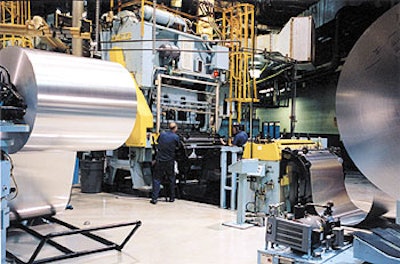 Rexam makes beverage cans (left) from huge coils of aluminum (above). The aluminum order is automatically processed for payment
