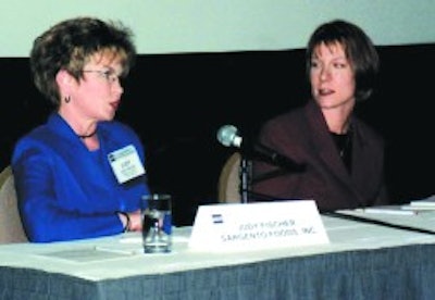 Judy Fischer (left), senior packaging engineer for Sargento Foods, answers a question while Juli Okal of 3M Co. awaits her turn.