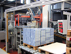 Among the automated machines that Grafiche Gelmini monitors on its new network is this palletizer, which stacks wrapped bundles